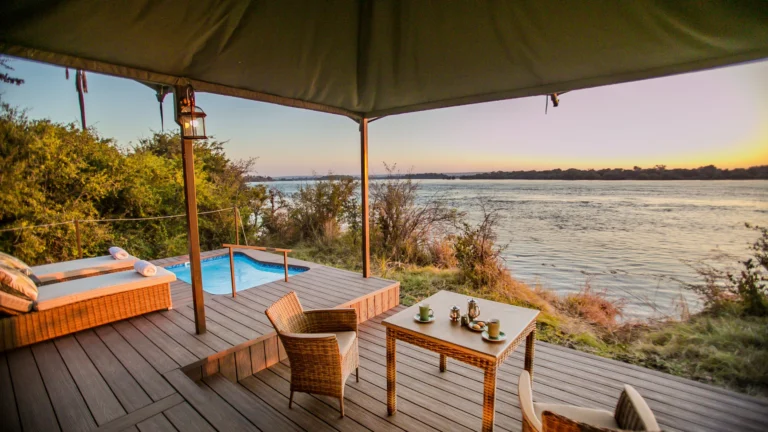 Luxury Standard Suite interior with king-size bed at Old Drift Lodge, Victoria Falls