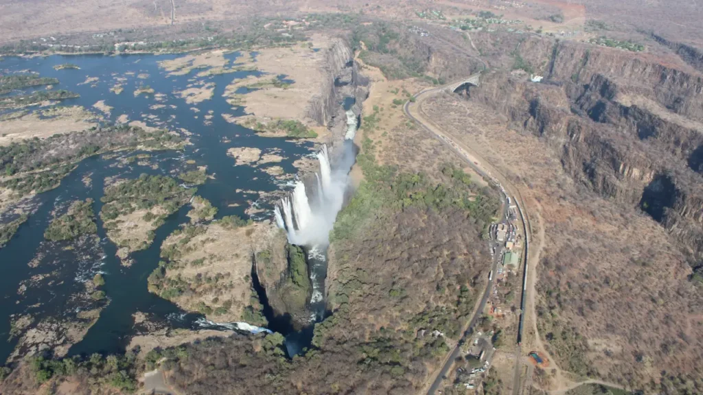 Aerial view of a vast landscape showcasing the Victoria waterfall