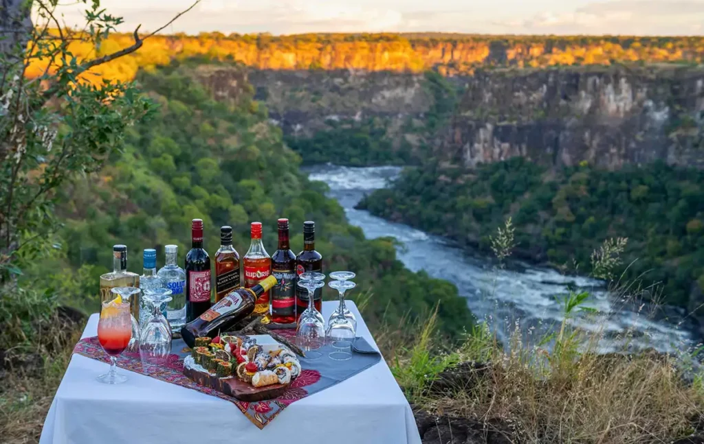 Sundowner drinks at Victoria Falls gorge viewpoint Zimbabwe