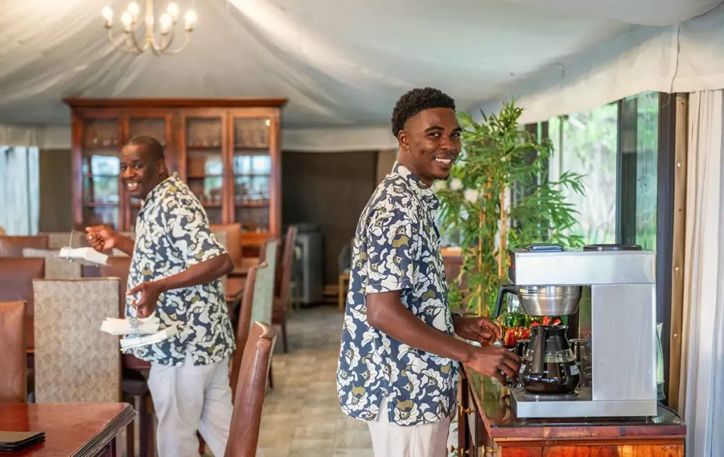 Smiling safari lodge staff at The Elephant Camp Victoria Falls